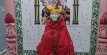 Saibaba photo during Shej Aarti