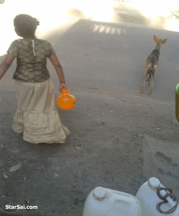 girl carrying water