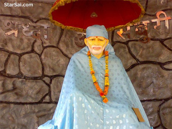 Sai Baba is smiling .Its a Big Sai baba statue in this temple