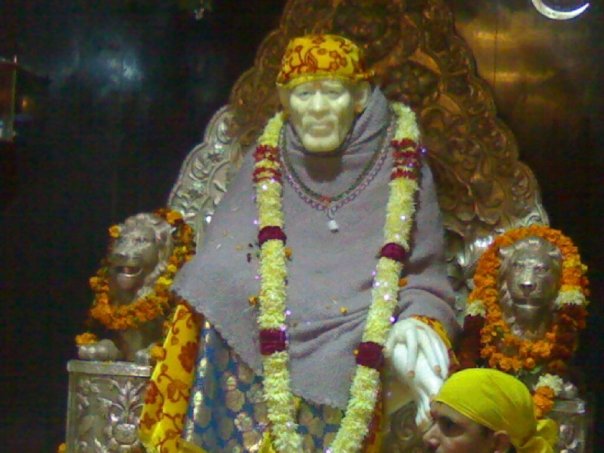 Sai baba sitting with smile to bless you in dehradun